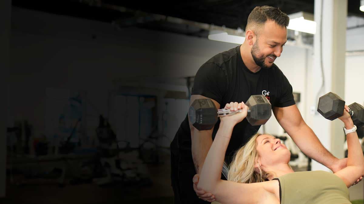 Personal trainer and client during a workout at Get Alpha Athletics